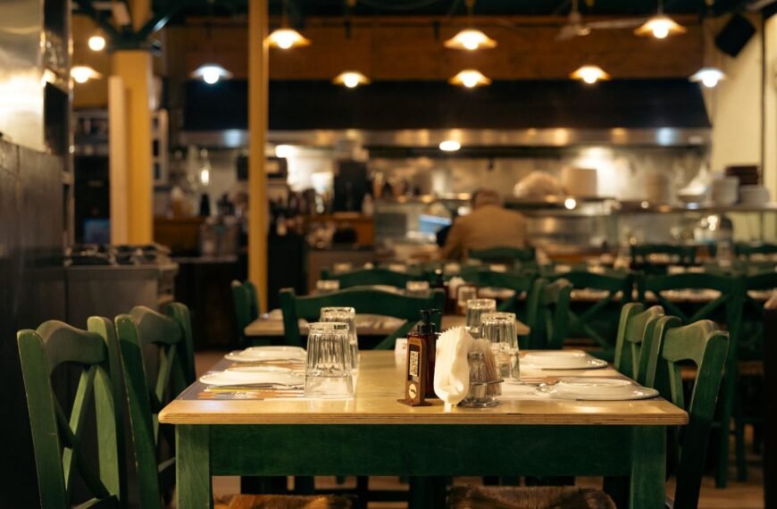 Warm and inviting Greek café interior with set dining tables in Athens, Greece.
